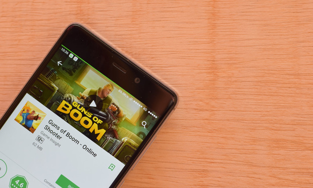Guns of Boom - Online Shooter Game application on Smartphone screen.