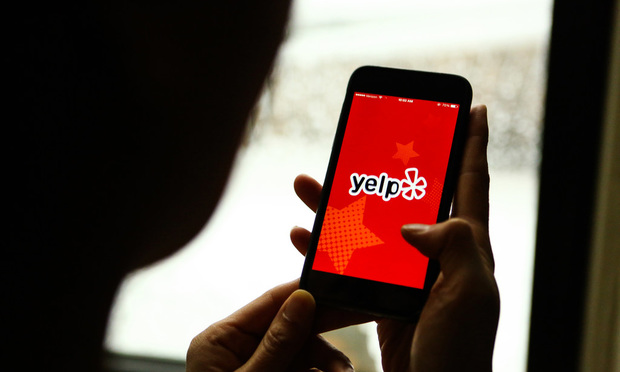 The Yelp Inc. application is displayed on an Apple Inc. iPhone in an arranged photograph taken in New York, U.S., on Friday, Feb. 5, 2016. Yelp Inc. is scheduled to report fourth-quarter earnings following the close of U.S. financial markets on February 8. Photographer: Chris Goodney/Bloomberg