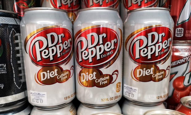 Subang Jaya, Malaysia - 30 April 2019 : DR PEPPER Diet Caffeine Free soda drink cans display for sale in the supermarket with selective focus..