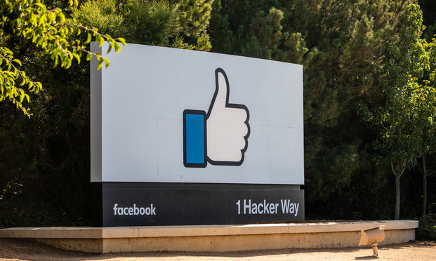 A giant thumbs-up button marks the entrance to the Facebook campus, located at 1601 Willow Road in Menlo Park, CA.