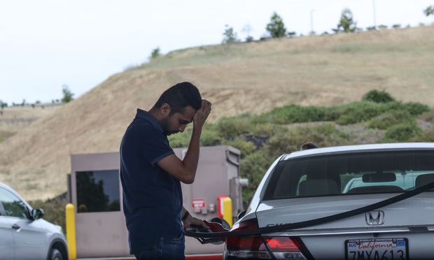 Man pumping gas at a Costco Gas Station in Folsom, CA. May 4, 2019.