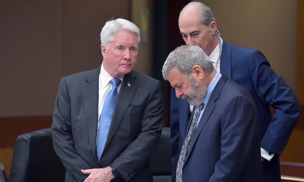Tex McIver confers with defense attorneys Bruce Harvey and Don Samuel (foreground) on Tuesday. (Pool photo by Hyosub Shin/AJC)