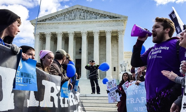 Protesters for and against abortion rallied outside the U.S. Supreme Court in March 2016. (Photo: Diego M. Radzinschi/ALM)