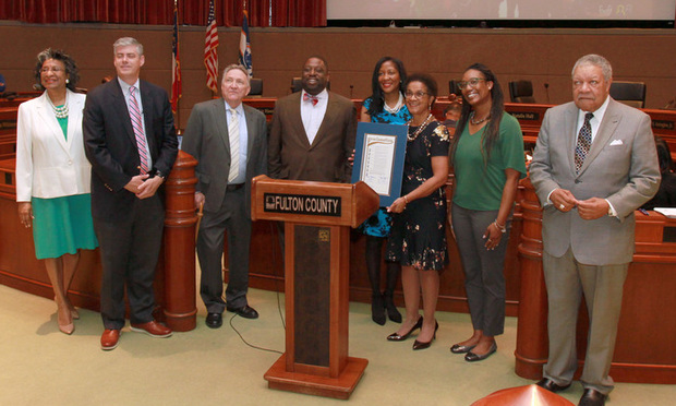 Judge Gail Tusan (center) poses with members of the Fulton County Commission after receiving a proclamation honoring her service on the Fulton County Superior Court. (Photo: John Disney/ALM)