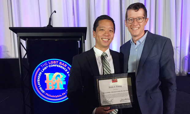 ACLU Georgia Legal Director Sean J. Young (left) with fiancé, Dave Mardis. Young was honored in Philadelphia Thursday by the LGBT Bar Association. Each year, the Washington, D.C.-based LGBT Bar “recognizes LGBTQ+ legal professionals under the age of 40 who have distinguished themselves in their field and have demonstrated a profound commitment to LGBTQ+ equality.” The honors came at the 2019 Lavender Law Conference and Career Fair, with approximately 1,700 attendees from around the country. Courtesy photo.