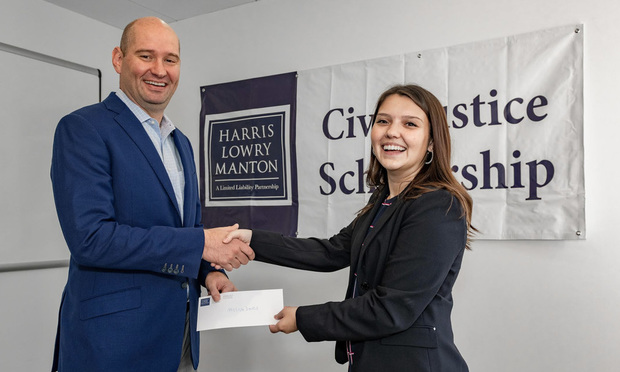 Jed Manton (left) of Harris Lowry Manton, presenting the law firm’s second annual $5,000 Civil Justice Scholarship to Georgia State University School of Law student Melissa Davies. (Courtesy photo)