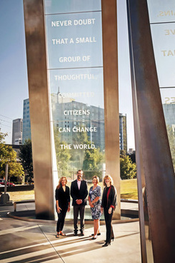 Akerman partners (from left) Anne Marie Garavaglia, Kinan Obeidin, Robin Johnson and Atlanta managing partner Sidney Welch in front of the National Center for Civil and Human Rights. (Courtesy photo)
