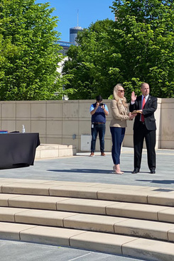 Georgia Governor Brian Kemp, right, administers the Oath of Office to John A. “Trea” Pipkin III, new judge on the Georgia Court of Appeals, center, during a ceremony held at Liberty Plaza outside the Capitol with no guests in attendance, and observing strict social distancing rules, due to the coronavirus outbreak, on Friday, April 10, 2020.