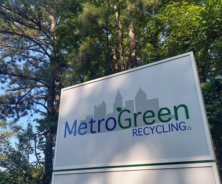 A photo of the Metro Green Recycling Plant sign.