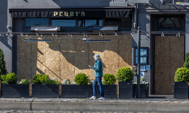 With the coronavirus pandemic keeping customers away in early April, boarded up Perry's Restaurant was one of the businesses struggling along San Francisco's Embarcadero. (Photo: Jason Doiy/ALM)