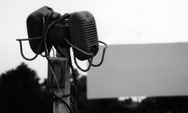 Speakers at a drive-in movie theater
