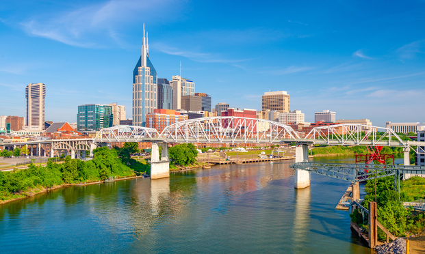 Nashville, Tennessee, USA downtown city skyline on the Cumberland River. - Sean Pavone/Shutterstock