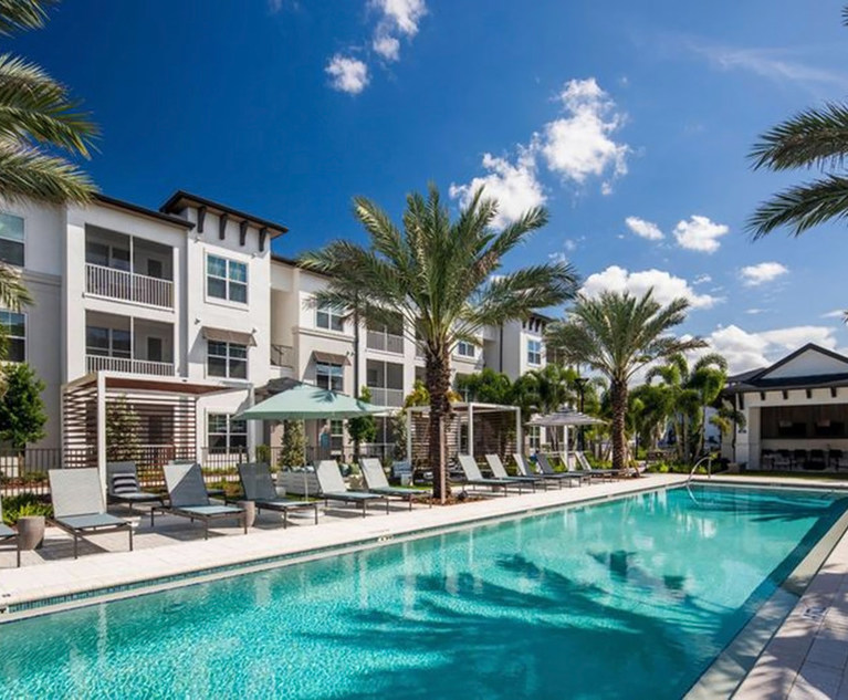 Hotel, condo with pool and palm trees