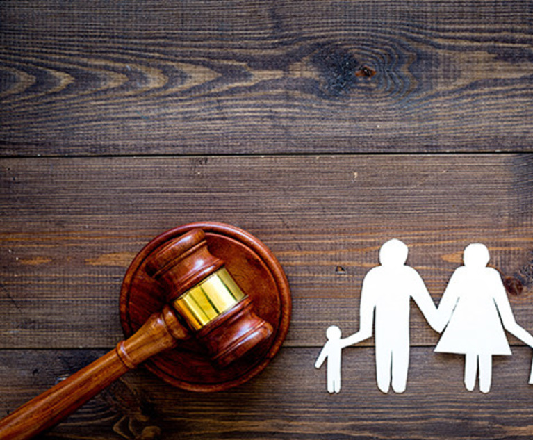 Family law, family right concept. Child-custody concept. Family with children cutout near court gavel on dark wooden background top view copy space