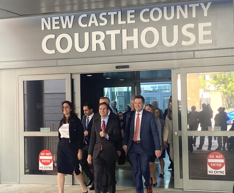 Lead Dominion attorneys Davida Brook, Brian Nelson and Stephen Shackelford of Susman Godfrey exit the Wilmington courthouse after reaching a settlement with Fox.